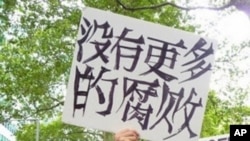 This “Occupy” protestor may have thought his sign said “No More Corruption.” Actually, as translated, it’s closer to “There isn’t any more corruption.”