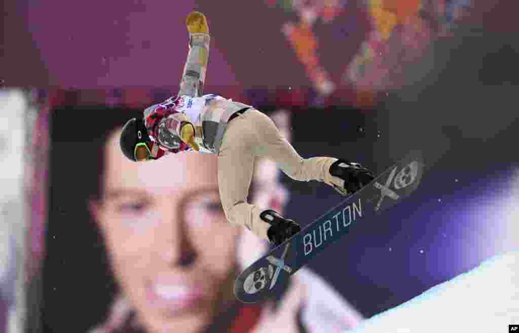 Shaun White of the U.S. performs a jump near a picture of himself during the men&#39;s snowboard halfpipe qualification round at the&nbsp;Rosa Khutor Extreme Park, Krasnaya Polyana, Russia,&nbsp;Feb. 11, 2014.&nbsp;