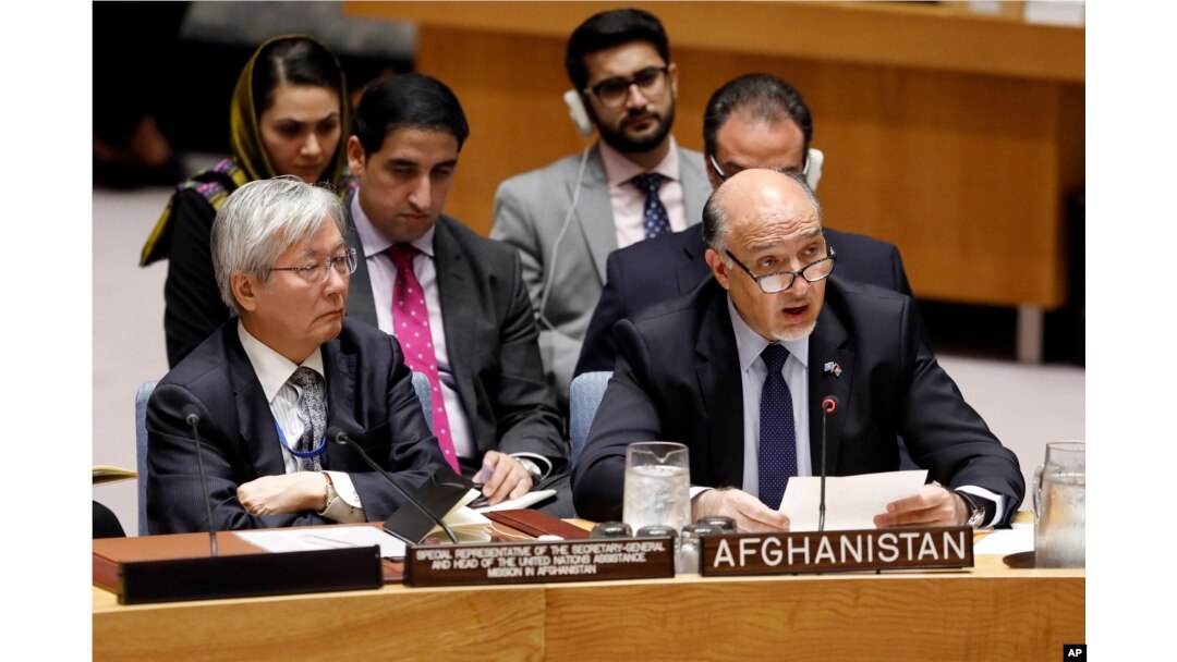 United Nations envoy for Afghanistan Tadamichi Yamamoto, left, listens as Afghanistan's U.N. Ambassador Mahmoud Saikal addresses the United Nations Security Council, at U.N. headquarters, Monday, Sept. 17, 2018.