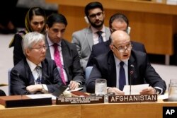 United Nations envoy for Afghanistan Tadamichi Yamamoto, left, listens as Afghanistan's U.N. Ambassador Mahmoud Saikal addresses the United Nations Security Council, at U.N. headquarters, Monday, Sept. 17, 2018.