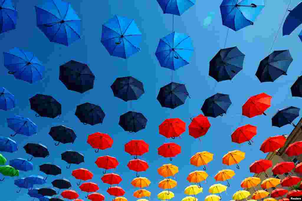 Colorful umbrellas decorate Dorner Platz (Dorner square) in Vienna, Austria.