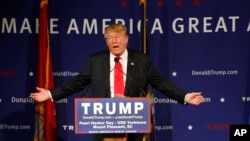 Republican presidential candidate Donald Trump speaks at a rally aboard the aircraft carrier USS Yorktown in Mount Pleasant, S.C., Dec. 7, 2015. He defended his plan to stop Muslims from entering the country. 