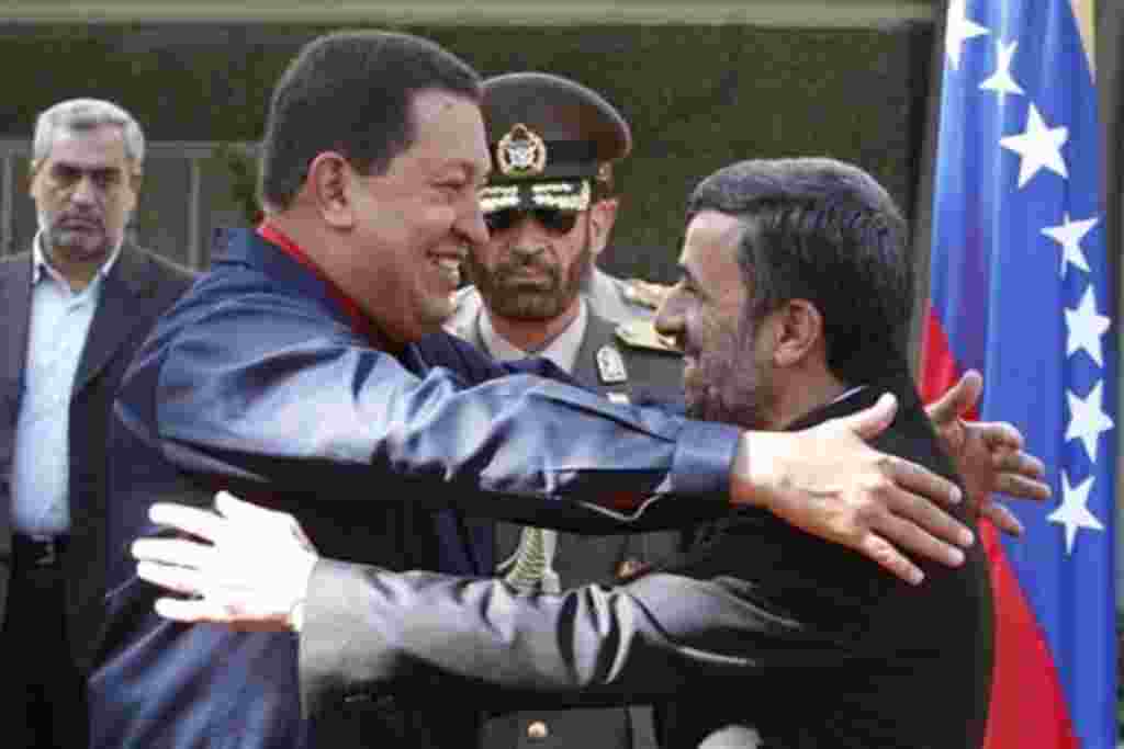 Iranian President Mahmoud Ahmadinejad, right, welcomes his Venezuelan counterpart Hugo Chavez, during official ceremony, in Tehran, Iran, 19 Oct. 2010.