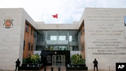 FILE - Members of the Moroccan special anti-terror unit are seen guarding the headquarters of the Central Bureau of Judicial Investigations in Sale near Rabat, Morocco, Jan. 5, 2016.