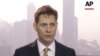 In this image made from a video taken March 28, 2018, North East Asia senior adviser Michael Kovrig speaks during an interview in Hong Kong.