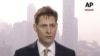 FILE - In this image made from a video taken on March 28, 2018, North East Asia senior adviser Michael Kovrig speaks during an interview in Hong Kong.