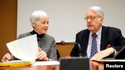 Paulo Pinheiro, Chairperson of the Commission of Inquiry on Syria, arrives with Karen Abuzayd, member of the Commission before the launch of their report on sexual and gender-based violence in Syria at the UN office in Geneva, March 15, 2018. 