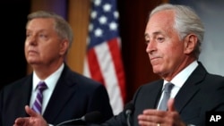 FILE - Sen. Bob Corker, R-Tenn., right, with Sen. Lindsey Graham, R-S.C., speaks at a news conference, Sept. 14, 2017, on Capitol Hill in Washington. 