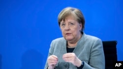 Germany's Chancellor Angela Merkel speaks at a press conference in the Federal Chancellery, Berlin, April 15, 2020. 