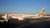 FILE - Workers service an Ethiopian Airlines Boeing 737-800 plane at the Bole International Airport in Ethiopia's capital Addis Ababa, Jan. 26, 2017.