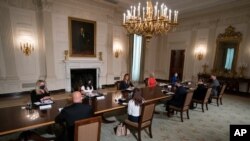 First lady Melania Trump receives an Indian Health Service (IHS) Task Force briefing on "Protecting Native American Children in the Indian Health System" at the White House in Washington, July 23, 2020. 