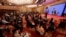 Journalists attend a news conference by Zhang Yesui, a spokesman for the National People's Congress, broadcast remotely to the media center on the eve of the annual legislature opening session in Beijing on Thursday, May 21, 2020.