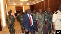 Michel Djotodia, center, rebel leader who declared himself president, arrives for meetings with government armed forces, Bangui, Central African Republic, March 28, 2013.