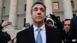 FILE - Michael Cohen walks out of federal court Nov. 29, 2018, in New York, after pleading guilty to lying to Congress about work he did on an aborted project to build a Trump Tower in Russia. 