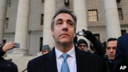 FILE - Michael Cohen walks out of federal court Nov. 29, 2018, in New York, after pleading guilty of lying to Congress about work he did on an aborted project to build a Trump Tower in Russia. 