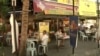 Smoking is not allowed within three meters of any table or chair at any eatery inside and outside in Malaysia. (Dave Grunebaum/VOA)