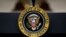 FILE - The Presidential Seal is seen on a lectern in the Roosevelt Room of the White House, in Washington, Sept. 4, 2019.