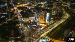 This aerial photograph shows students and citizens attending a demonstration as they block the main boulevard in the central Serbian city of Kragujevac on February 15, 2025, continuing months long calls for government accountability and reforms.