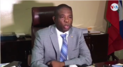 FILE - Senator Carl Murat Cantave, President of the Haitian Senate, speaks to reporters