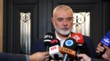 This handout picture provided by the Iranian foreign ministry on December 20, 2023, shows Qatar-based Hamas leader Ismail Haniyeh speaking to journalists as he welcomes the Iranian foreign minister (not in the picture), in Doha. (Photo by Iranian Foreign 