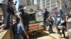 A heavily guarded vehicle carries Oscar Pistorius to prison, Pretoria, South Africa, Oct. 21, 2014.