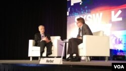 FBI General Counsel James Baker (left) is interviewed by Newseum CEO Jeffrey Herbst (right) during the South by Southwest (SXSW) Conference & Festivals in Austin, Texas. (T. Trinh/Facebook)