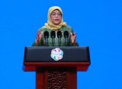 FILE - Singapore's President Halimah Yacob delivers a speech during the opening ceremony of the Conference on Dialogue of Asian Civilizations in Beijing, China, May 15, 2019.