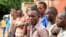Suspected fighters are paraded before the media by Burundian police after clashes in the capital Bujumbura, Burundi, Dec. 12, 2015. 