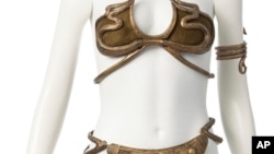 This photo provided by Heritage Auctions shows the gold bikini-style costume that Carrie Fisher wore as Princess Leia while making “Return of the Jedi” in the “Star War” franchise, which was sold for $175,000 during an auction July 26, 2024.