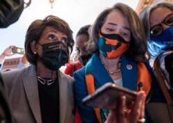 From left, Rep. Maxine Waters, D-Calif., Rep. Lisa Blunt Rochester, D-Del., Rep. Robin Kelly, D-Ill., and other members of the Congressional Black Caucus monitor their mobile phones for the verdict in the murder trial of Derek Chauvin.