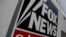 FILE - A Fox News channel sign is seen on a television vehicle outside the News Corporation building in New York City, Nov. 8, 2017. 