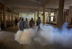 Volunteers of the Aun Rizvi Trust disinfect a mosque ahead of the Muslim fasting month of Ramadan, in Rawalpindi, Pakistan, April 21, 2020.