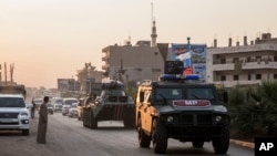 Russian forces patrol in the city of Amuda, north Syria, Oct. 24, 2019. 