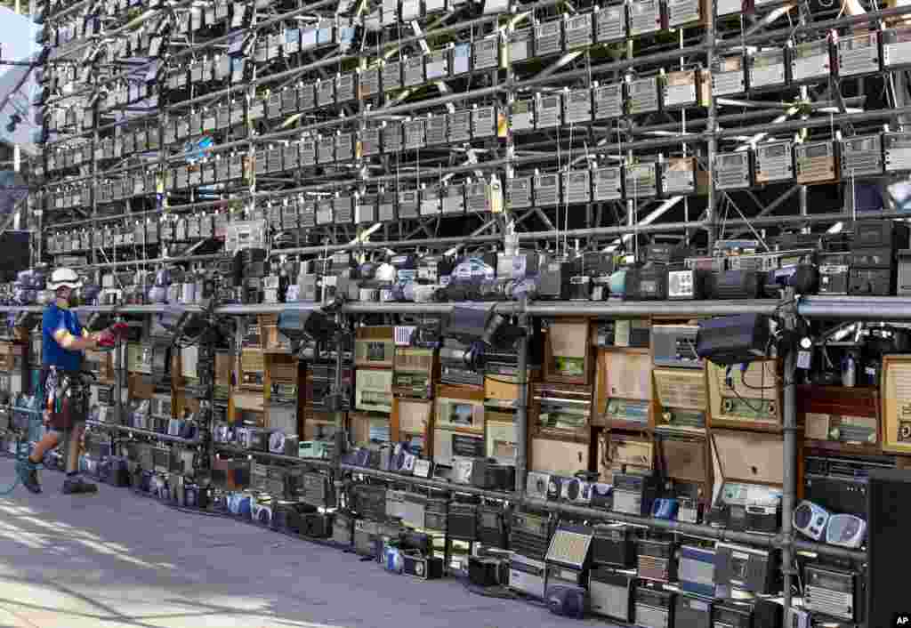 A technician prepares a huge construction made up of nearly 1,500 old radios on Vilnius Cathedral square, to mark events of 1989 when analog radios were used to plan so-called Baltic Way human chain, in Vilnius, Lithuania.