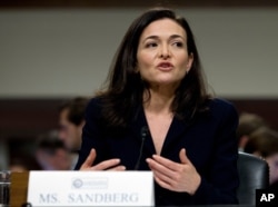 FILE - Facebook COO Sheryl Sandberg testifies before the Senate Intelligence Committee hearing on Capitol Hill, Sept. 5, 2018.