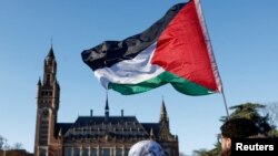 FILE - Demonstrations outside the International Court of Justice in The Hague.