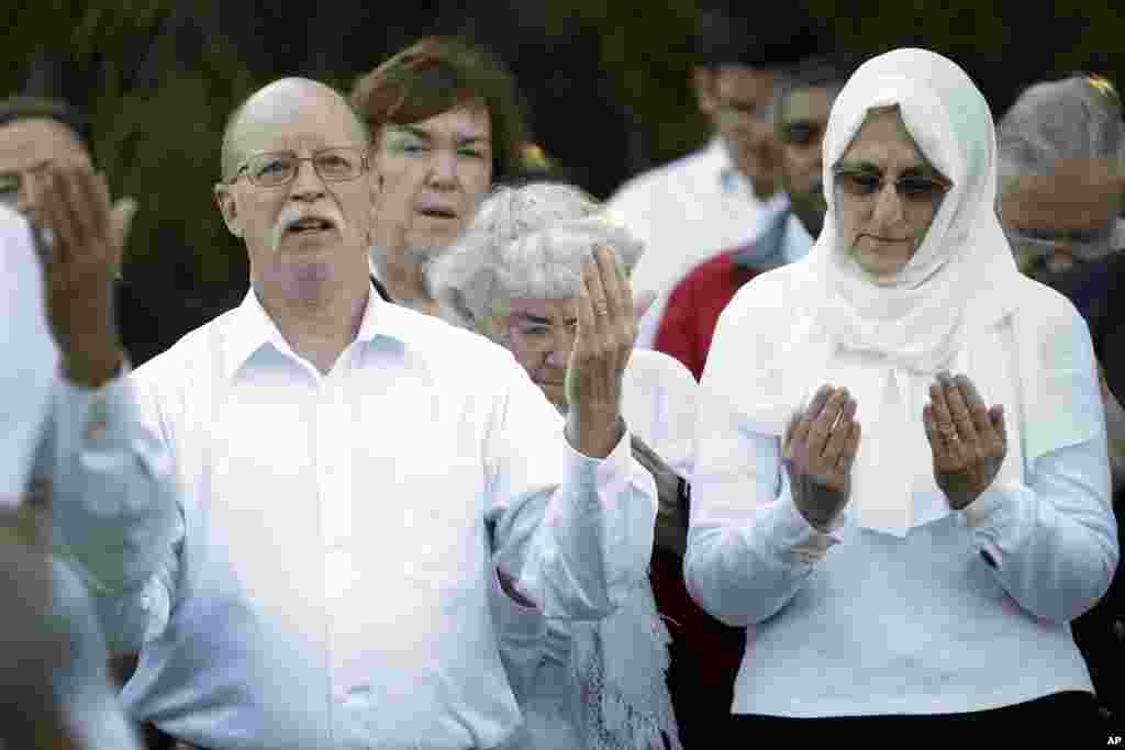 Ed and Paula Kassig, in foreground, pray at a vigil for son Abdul-Rahman Kassig at Butler University in Indianapolis, Indiana, on Oct. 8, 2014.