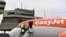 FILE - Passengers board an easyJet plane at Tegel Airport in Berlin, Germany, Jan. 5, 2018 for the British airline's first domestic flight within Germany.