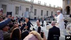 Pope Francis leaves at the end of his weekly general audience, in St. Peter's square, at the Vatican, Nov. 21, 2018.