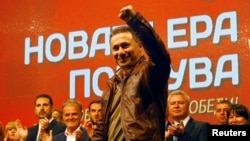 FILE - Nikola Gruevski, former prime minister of Macedonia, greets supporters during a pre-election rally in Veles, Oct. 12, 2017. Gruevski, 47, was formally replaced as VMRO-DPMNE party leader on Dec. 23, 2017.