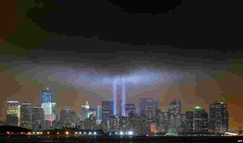 The "Tribute in Lights" is illuminated next to One World Trade Center. marking the 10th anniversary of the 9/11 attacks on the World Trade Center, New York, Sept. 11, 2011. (Reuters)