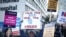 NHS nurses display signs at a strike, due to a dispute with the government over pay, outside St Thomas' Hospital in London, Britain Dec. 15, 2022. 
