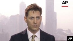 In this image made from a video taken March 28, 2018, North East Asia senior adviser Michael Kovrig speaks during an interview in Hong Kong.