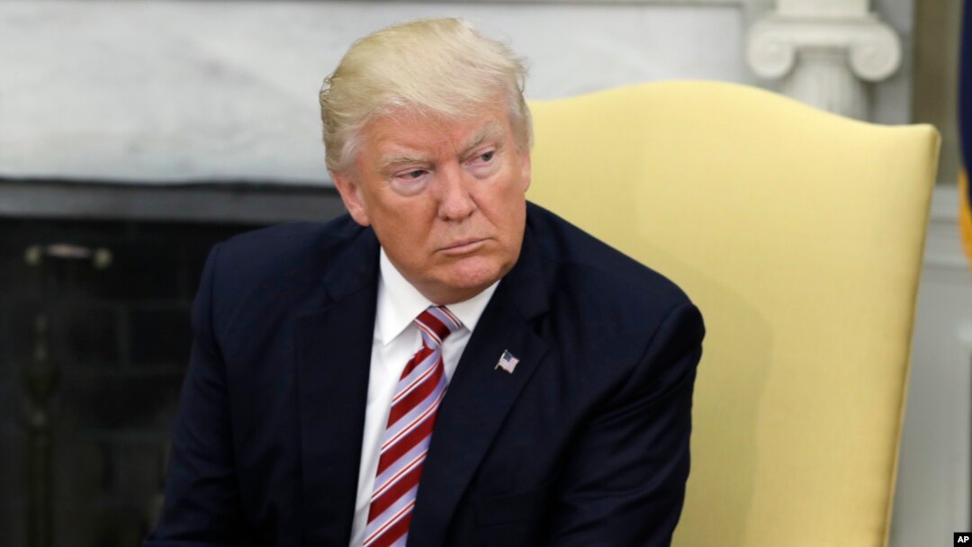President Donald Trump talks to reporters in the Oval Office of the White House in Washington, May 10, 2017.