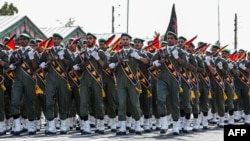 FILE - A handout photo from the Iranian presidency issued Sept. 22, 2019, shows members of the Islamic Revolutionary Guard Corps during a military parade.