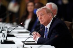 President Donald Trump listens during a "National Dialogue on Safely Reopening America's Schools" event in the East Room of the White House, July 7, 2020.