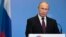 FILE - Russian President Vladimir Putin delivers his speech attending the World Health OrganiZation ministerial conference in Moscow, Russia, Nov. 16, 2017. 