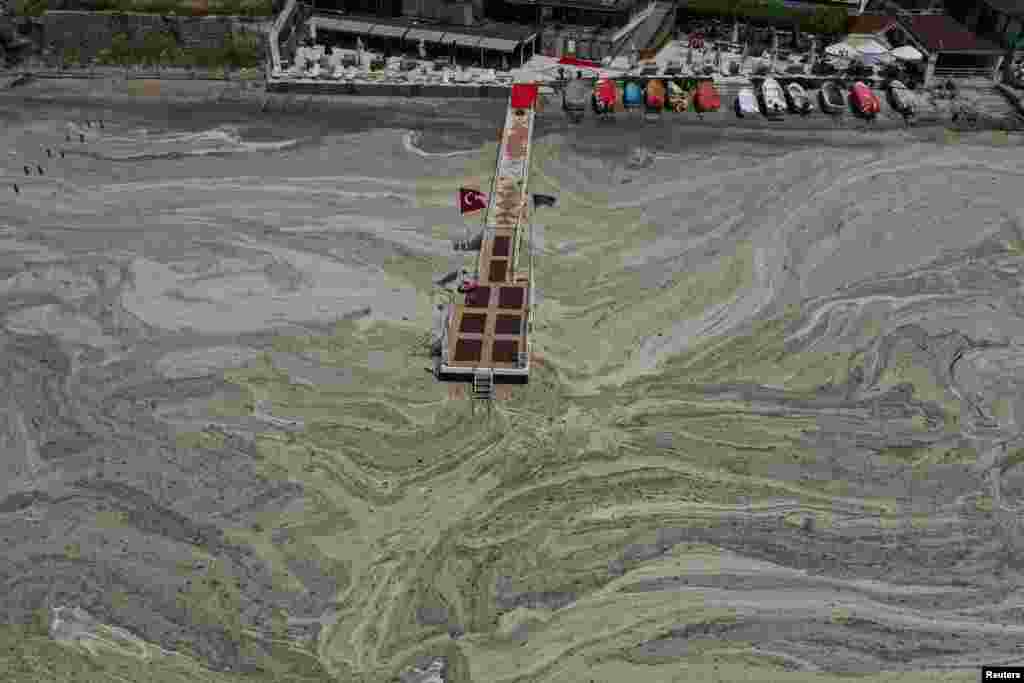 Aerial view of sea snot, a thick slimy layer of the organic matter also known as marine mucilage, spreading through the Sea of Marmara and posing a threat to marine life and the fishing industry, on the shores of Istanbul, Turkey, June 12, 2021.