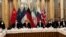 FILE - Negotiators wait for the start of talks on the Iran nuclear deal in Vienna, Austria, Dec. 3, 2021. Western diplomats seeking to revive the 2015 deal that curbed the Iranian nuclear program later hit the pause button on the talks, blaming Iran for a lack of progress.
