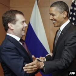 Russian President Dmitry Medvedev, left, meets with US President Barack Obama on the sidelines of the APEC summit in Yokohama, Japan, 14 November 2010